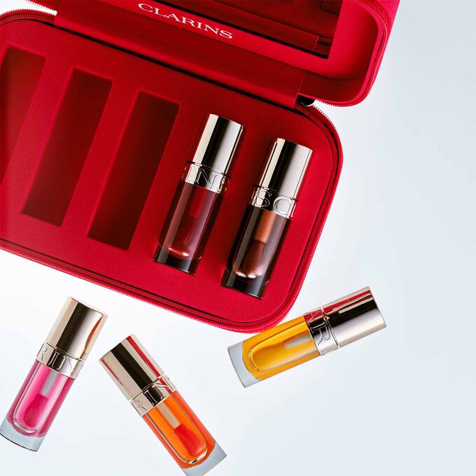 Nærbilde av innsiden av etuiet, som viser de forskjellige rommene som holder Lip Oils.