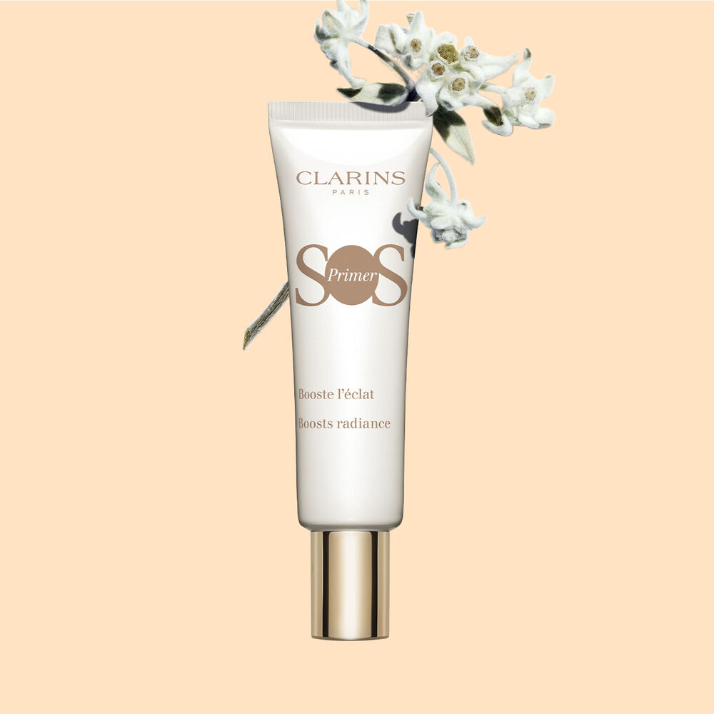 Pakkebilde av en tube med SOS Primer White fra Clarins med edelweissekstrakt for å øke gløden og gi strålende hud.