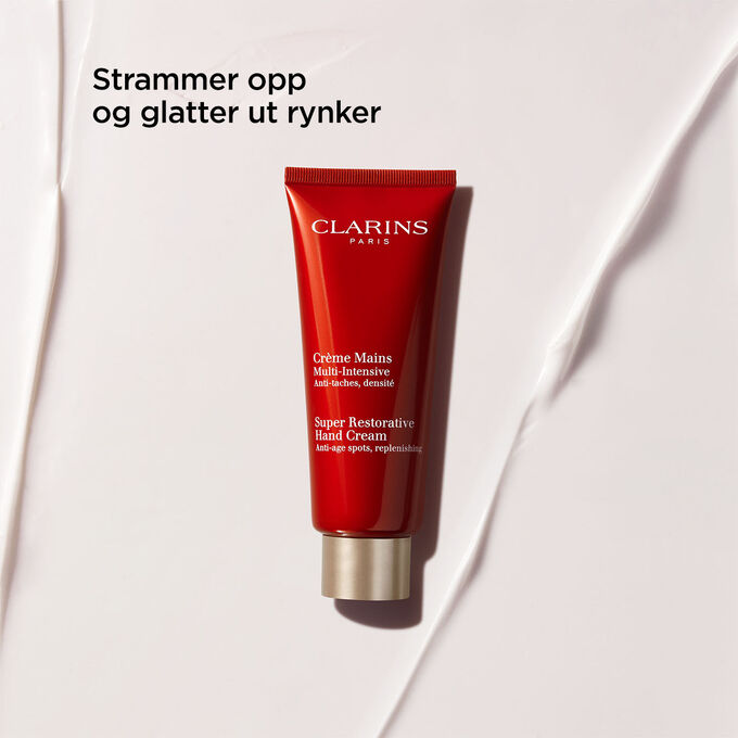 Pakkebilde av Clarins Super Restorative Hand Cream, med fremheving av de oppstrammende og rynkeutglattende egenskapene.