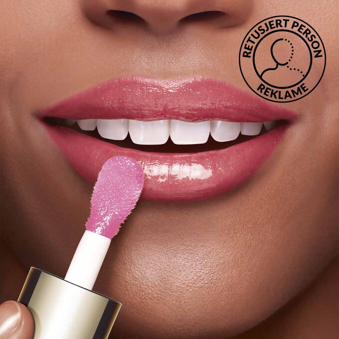 Close-up of a woman's lips showing the effect of Clarins Lip Comfort Oil.