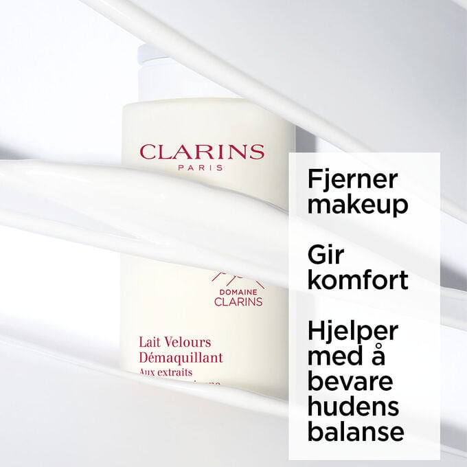 Packshot av den beige flasken med Velvet Cleansing Milk fra Clarins, delvis skjult, med tekst om dens rensende og rensende effekt.