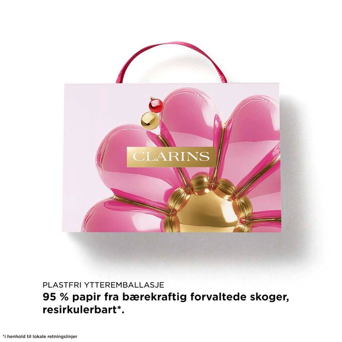 Clarins Lip Oils-julesett med tekst om en toalettmappe laget av 87 % resirkulerte fibre &ndash; en b&aelig;rekraftig julegave