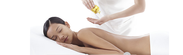 Woman being massaged / Woman having her face massaged